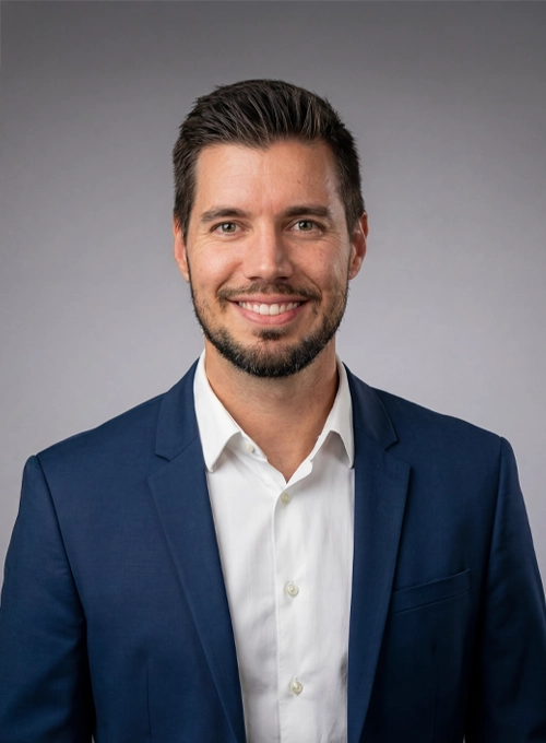 Chiropractor Jared Wootton Smiling In Blazer