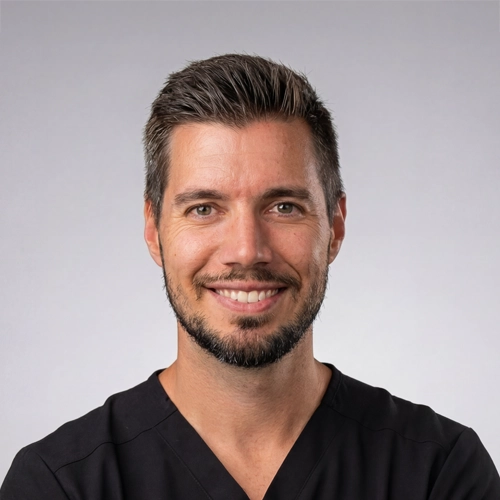 Neuropathy Specialist Jared Wootton Smiling In Scrubs Close Up